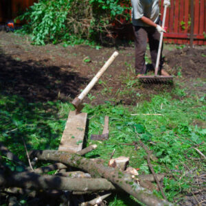 A Man Arranging His Piece Of Land With Handtools, Summertime Outdoor Shot