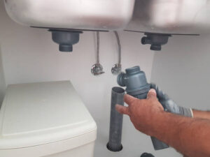 Plumber Pipette Sink Woriking On Adjustment